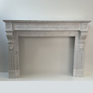 Original Louis XVI Mantel in Carrara Marble with Acanthus Leaf Corbels, In-sized Panels and Brass Side Vents